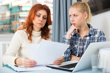 Woman emotionally complaining about poor academic performance of her daughter