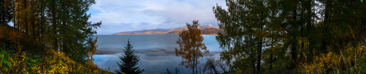 Beautiful lake in autumn.Fall nature background. Wonderful nature landscape. Markakol lake, Kazakhstan. Travel in Kazakhstan concept. Autumn background.