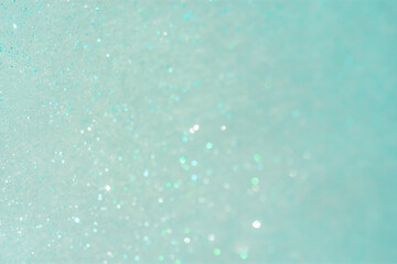 Abstract mint background with small sequins. The trending color of 2021. Bright greenish-turquoise shades. Christmas holiday shimmering background. Layout of a postcard or banner for the New year.