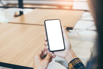 cell phone blank white screen mockup.woman hand holding texting using mobile on desk at office.background empty space for advertise.work people contact marketing business,technology