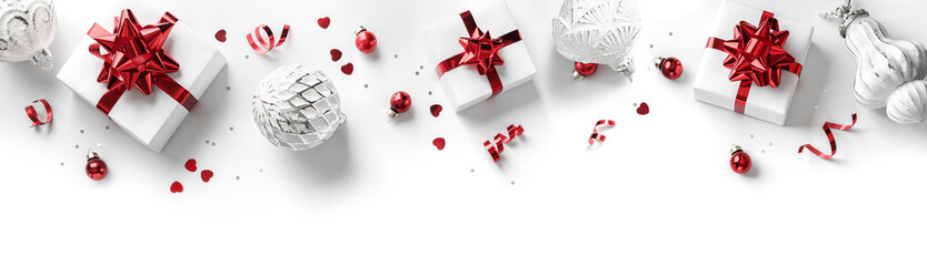 Merry Christmas card made of gift boxes, red and silver decoration, sparkles and confetti on white...