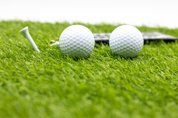 Golf Christmas with golf ball and Christmas ornament on green grass