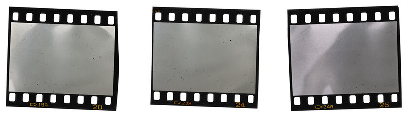 Fototapeta premium three blank or empty 35mm film snips with nice light reflections on white background. cool photo placeholder for your poster or cover idea.