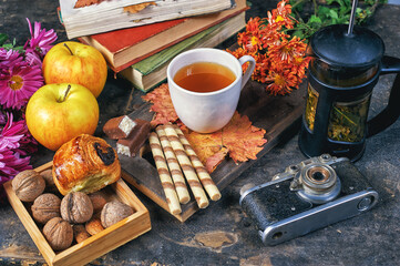 Cup of tea and berries, fruits and sweets on the table