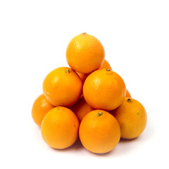 Tangerines are laid out in a pyramid on a white background, close-up, copy space, isolated