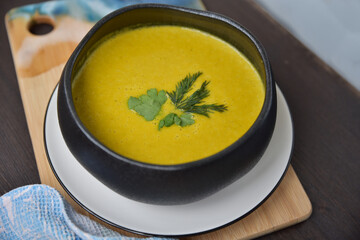 Cream of broccoli soup. Yellow autumn soup for a meal in the middle of the day. Delicious view of the first course.