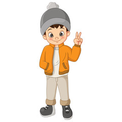 Cute boy in winter clothes showing peaceful sign