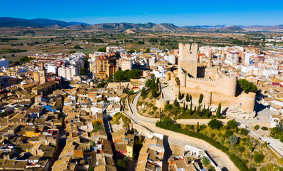View from drone of cityscape of Villena and medieval moorish Atalaya castle on sunny fall day,...