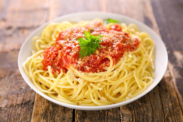 spaghetti with tomato sauce and parmesan