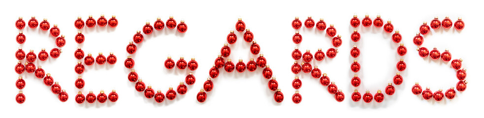 Red Christmas Ball Ornament Building English Word Regards. Festive Christmas Decoration. White Isolated Background