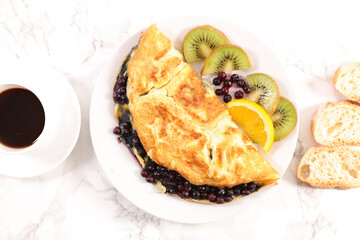 healthy breakfast- omelet with fresh fruitand coffee cup