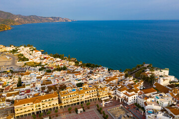 Picturesque summer view from drone of coastal Mediterranean town of Nerja, Axarquia, Andalusia, Spain.