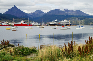 Modern cruise ship, cruiseship liner or expedition vessel ship in port of Ushuaia, Argentina with...