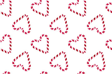 Seamless Christmas pattern with candy cane with white and red stripes. Hand painted watercolor illustration on white background