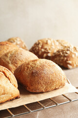 Cooling rack with fresh baked buns on gray background