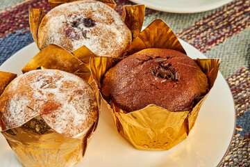 coffee and muffins on table in cafe close up