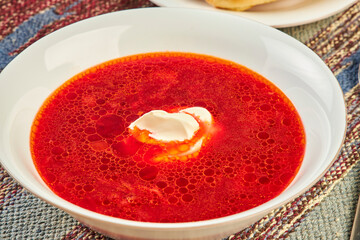 bowl of beet root soup borsch on table close up