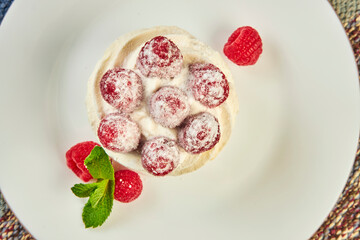 Raspberry cake on table in cafe close up