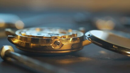 Nice watchmaker's workshop with many parts and gears, disassembled mechanical watch,