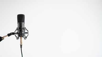 Professional microphone on a white background. Sound recording and broadcasting equipment
