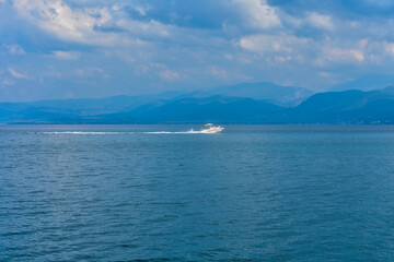 Fototapeta na wymiar A speedboat sails the sea