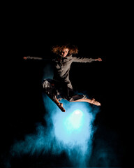 Fototapeta na wymiar Woman having fun and jump high in the air