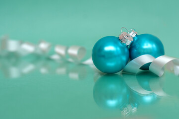 Christmas decorations on a green background. Two balls