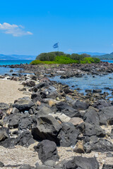 rocky beach and the flag