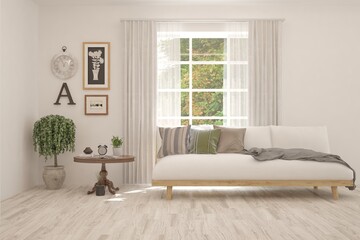 White living room with sofa and summer landscape in window. Scandinavian interior design. 3D illustration