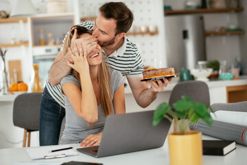 Wife's birthday. Husband surprise his wife with birthday cake..