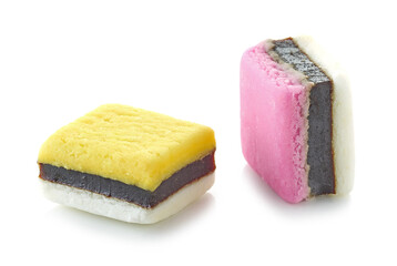 two pink and yellow candies with licorice