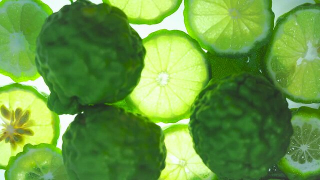 Top view Rotate of Transparent Slice of Bergamot fruit  on white background, Close up fresh Bergamot sliced on white background and slowly rotating.