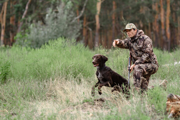 Hunter Gives Command to Pointer Dog is Running.