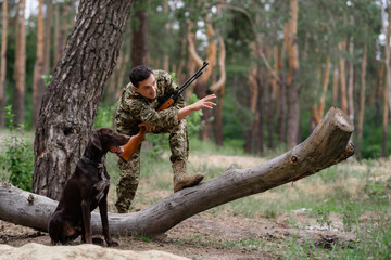 Hunter Gives Command to Dog Cynologist Hunting.