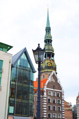 Fototapeta na wymiar Town Hall Square, St. Peter Church in the background, the old city of Riga, Latvia. Vertical view