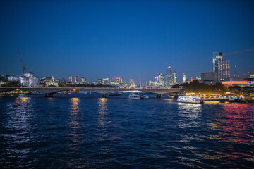 River Thames at night and with the lights of the city reflecting on the water