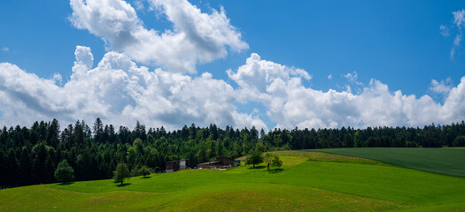 Idyllic rural view of farmland in the beautiful surroundings near Basel, Switzerland, Europe, close to the France and German borders. Fields and wonderful blue sky, panoramic view with shadows.