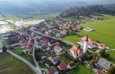 small beautiful mountain village and flooded fields