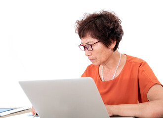 Chinese older women are working in front of a laptop