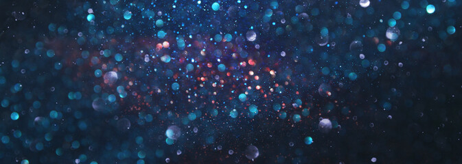 background of abstract glitter lights. silver, blue and black. de focused