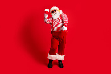 Full length body size view of his he handsome bearded fat overweight cheery glad childish Santa...