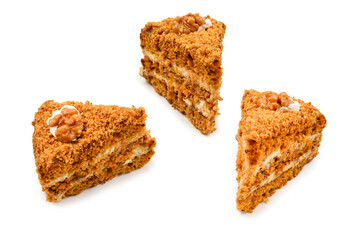 Peace of honey cake isolated on white background.