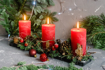 Christmas decoration composition with red candles