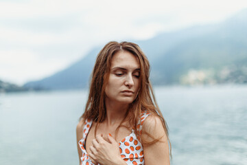 Beautiful girl on the shores of Lake Como