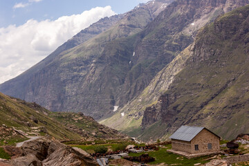A log cabin on a hilly slope near the Rohtang pass above Manali in Himachal Pradesh in the Indian himalayas.