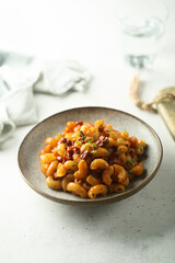 Pasta with tomato sauce and salami