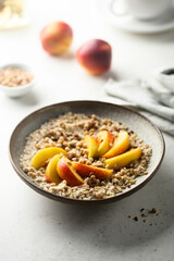 Healthy oatmeal porridge with fresh peach
