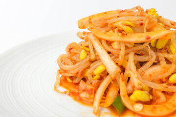 Tossed bean sprouts on a white background