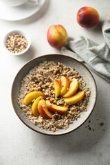 Healthy oatmeal porridge with fresh peach