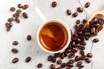 Top view on brewed espresso coffee in a white mug